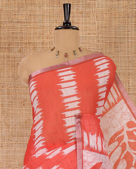 Rust shibori-dye style printed linen cotton saree, piping border, batik leaf printed pallu and a contrast batik printed blouse