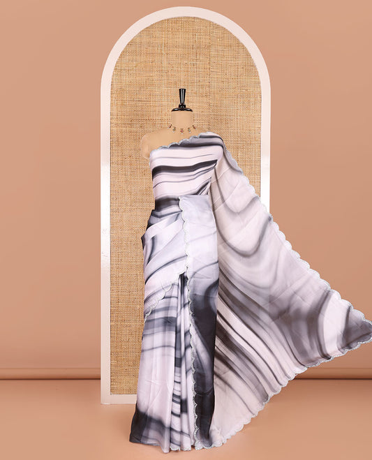 Black and white abstract printed satin crepe saree, scallop jarkan stone work border, self-pallu, and a contrast abstract printed blouse