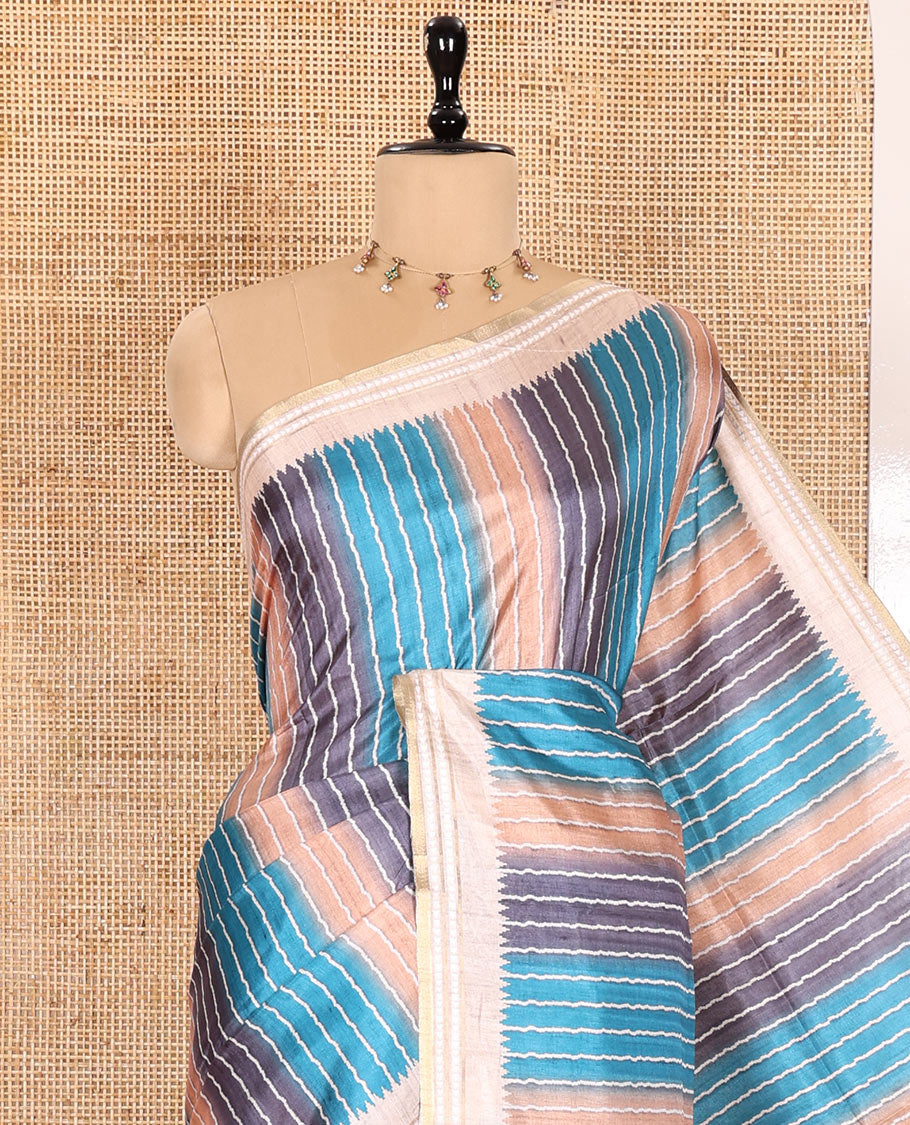 Blue Semi-Tussar Saree Colorfully Printed with Zig-Zag Stripes, Subtly Woven with a Resham Thread Temple Border, Featuring a Heathered Pallu, Paired with a Contrast Striped Blouse