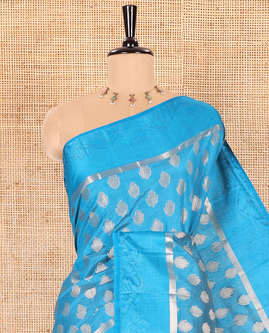 Blue Semi-Tussar Saree Bedecked with Copper Zari Floral Bud Motifs, Featuring a Floral Creeper Embossed Border, Complemented by a Contrast Pallu Adorned with Floral Bud Motifs, and Paired with a Contrast Blouse