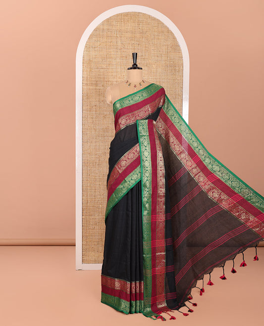 Black Plain Khadi Mul Cotton Saree, Complemented by Contrast Rettai Pettu Diamond Patterns Zari Border, Subtly Striped Pallu, and Paired with a Matching Blouse