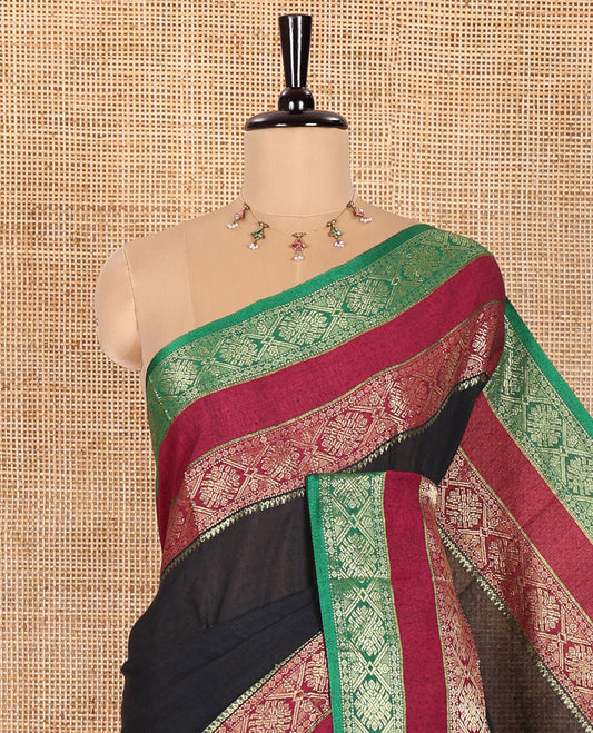 Black Plain Khadi Mul Cotton Saree, Complemented by Contrast Rettai Pettu Diamond Patterns Zari Border, Subtly Striped Pallu, and Paired with a Matching Blouse