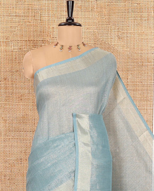 Blue Tissue Saree, Gleamed Up with Zari Striped on Its Body, Highlighted by a Zari Border, Pallu Steeped with Zari Stripes, and Paired with a Matching Blouse