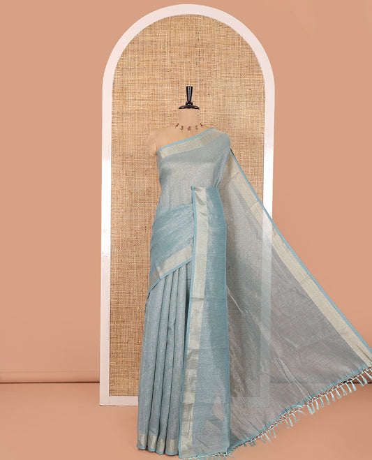 Blue Tissue Saree, Gleamed Up with Zari Striped on Its Body, Highlighted by a Zari Border, Pallu Steeped with Zari Stripes, and Paired with a Matching Blouse