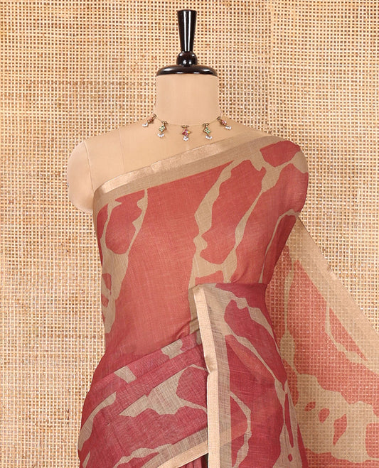 Chikku Linen Cotton Saree, Adorned with Shibori Prints on Its Body, Subtle Contrast Piping Border, Pallu of Floral Print, and Paired with a Matching Blouse