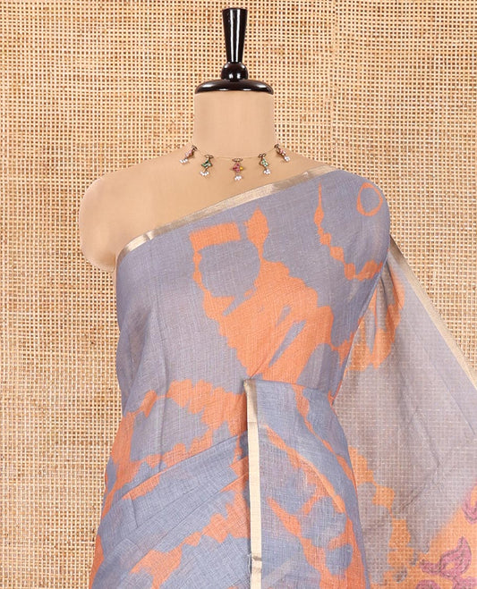 Grey Linen Cotton Saree, Detailed with Shibori Printed on Its Body, Subtle Piping Border, Pallu Features Floral Print, and Paired with a Contrast Floral Printed Blouse