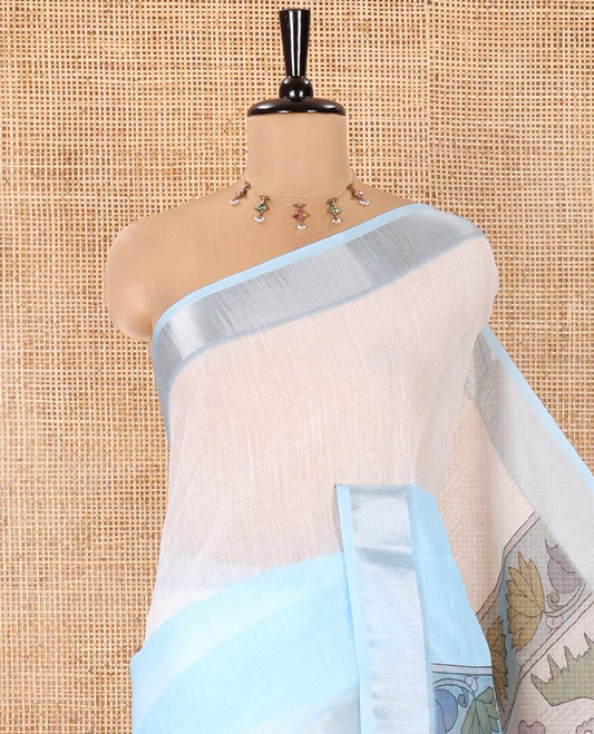 Cream and Blue Linen Cotton Saree, Beautified with Ombre-Style Double-Color Print, Highlighted by Contrast Zari Bavanji Border, Pallu Pictures Floral Prints, and Paired with a Floral Printed Blouse