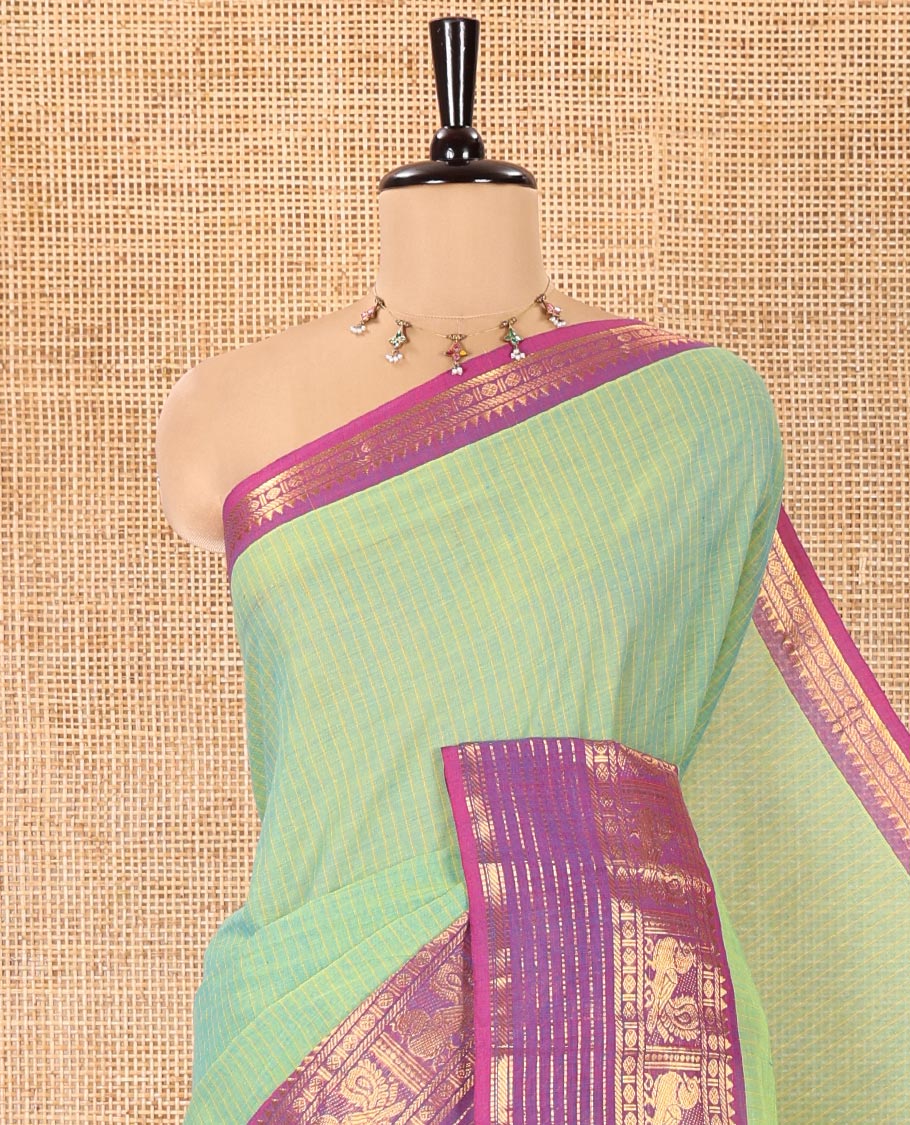 Sea Green Chettinad Cotton Saree, Subtly Sparkled with Stripes on Its Body, Complemented by a Contrast Traditional Design Zari Border, Subtly Striped Pallu, and Paired with a Matching Blouse