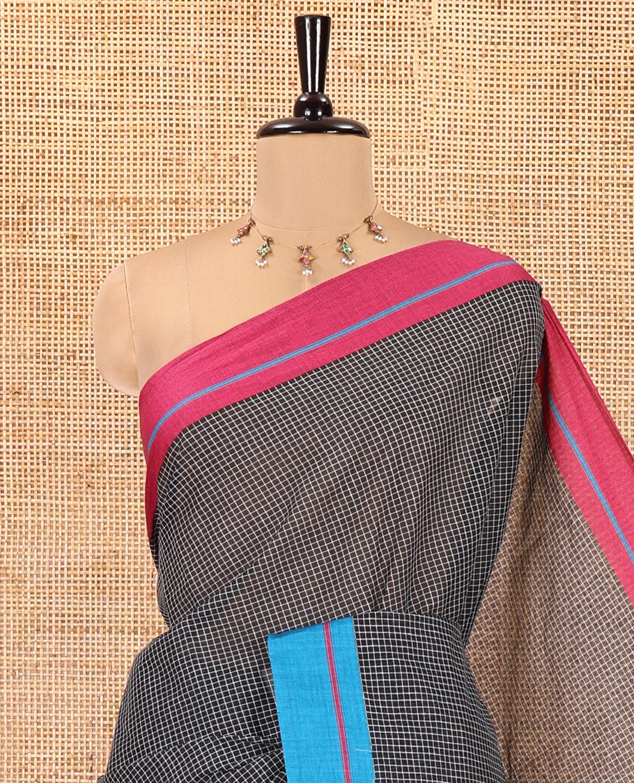 Black and Pink-Blue Chettinad Cotton Saree, Subtly Sparkled with Checked Design on Its Body, Complemented by Contrast Ganga-Jamuna Border, Striped Pallu, and Comes Without a Blouse