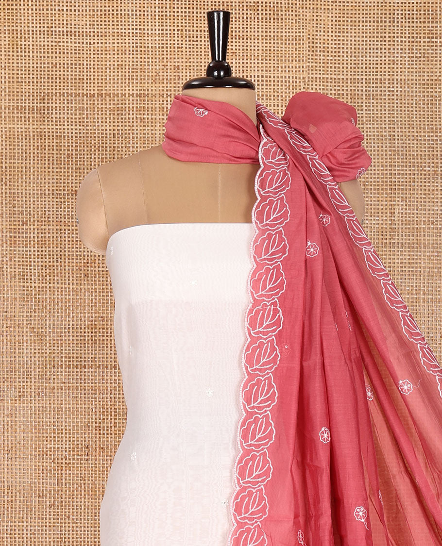 Cream and Red Mul Chanderi Material Chudidar Set, Artfully Detailed with Floral Embroidery On Its Top, A Plain Santoon Bottom, and Comes with a Contrast Scallop Floral Embroidered Dupatta