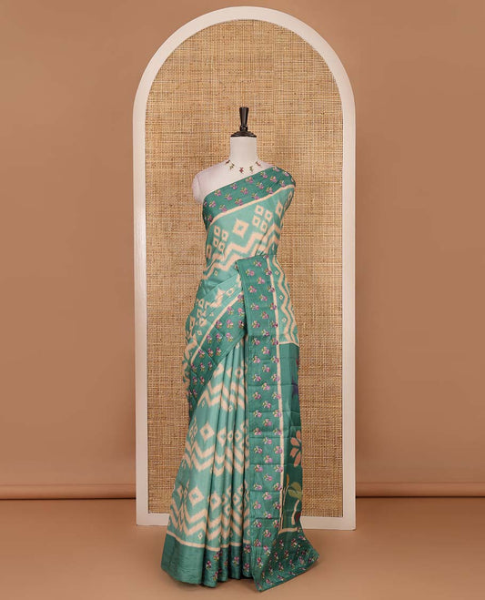 Green pochampally ikkat style geometric printed fancy tussar saree, contrast floral motifs thread embroidered border, ikkat printed pallu, and plain blouse