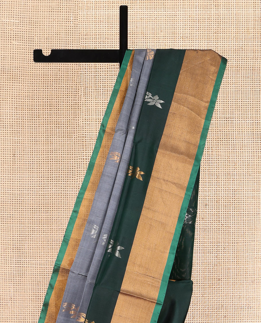Grey Uppada Silk Saree, Subtly Sparkled with Buttas All Over Its Body, Complemented by a Contrast Bavanji Border of Zari Buttas, Pallu Steeped with Zari Buttas, and Paired with a Contrast Blouse