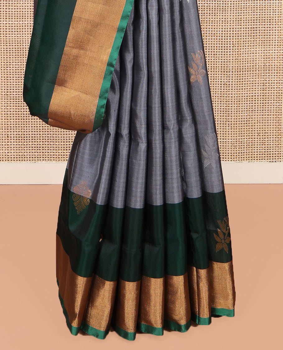 Grey Uppada Silk Saree, Subtly Sparkled with Buttas All Over Its Body, Complemented by a Contrast Bavanji Border of Zari Buttas, Pallu Steeped with Zari Buttas, and Paired with a Contrast Blouse