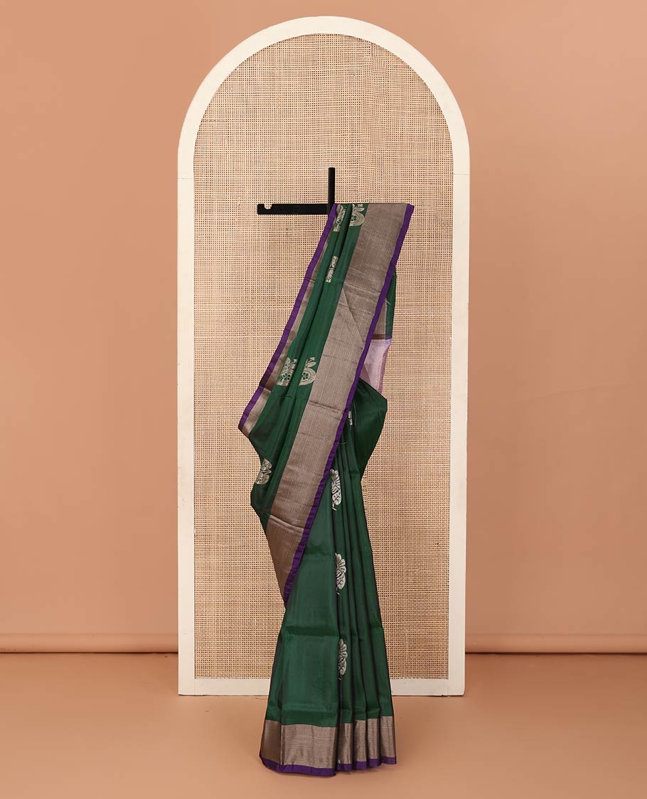 Deep green zari buttas Uppada saree, contrast bavanji border, and jaal patterned pallu