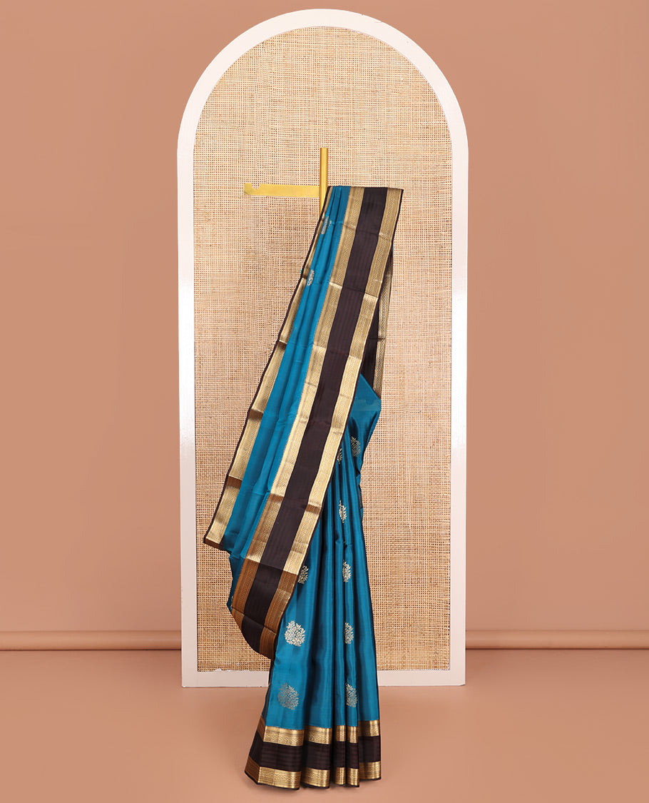 Blue Vasundhara Lite-Silk Mix Saree, Ornamented with Zari Buttas, Complemented by a Contrast Border of Traditional Zari Designs, Grand Pallu of Thilakam Patterns, and Paired with a Contrast Blouse
