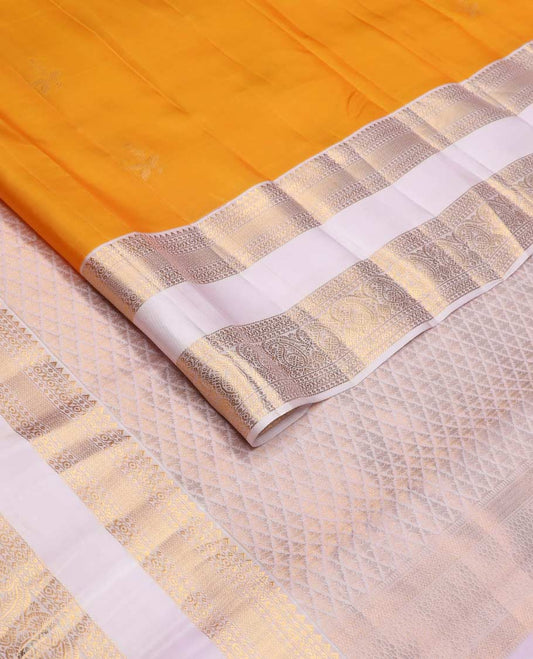 Orange zari buttas Vasundhara silk mix saree, contrast rettai pettu border of rekku, cross kamalam, and manga designs
