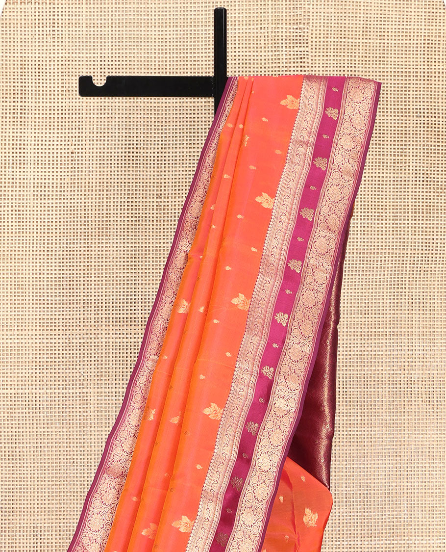 Orange Vasundhara Lite Silk Mix Saree, Accentuated with Zari Buttas, Complemented by a Contrast Border of Thilakam Mokku, and Kodi Visiry Designs, Pallu of Floral Jaal Designs, and Paired with a Contrast Blouse