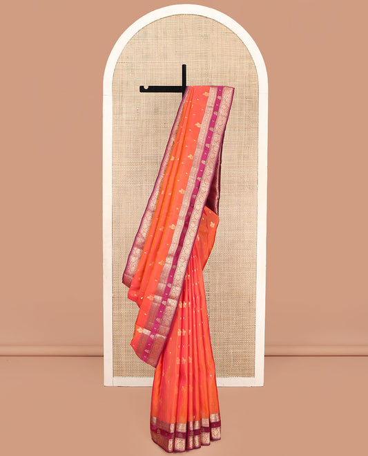 Orange Vasundhara Lite Silk Mix Saree, Accentuated with Zari Buttas, Complemented by a Contrast Border of Thilakam Mokku, and Kodi Visiry Designs, Pallu of Floral Jaal Designs, and Paired with a Contrast Blouse