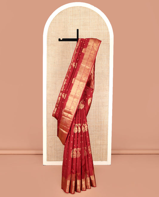 Red Vasundhara Lite Silk Mix Saree, Ornamented with Manga Zari Buttas on Its Body, Highlighted by a Zari Border of Rekku, Yaanai, and Rudraksham Designs, Pallu of Diagonal Designs, and Paired with a Matching Blouse