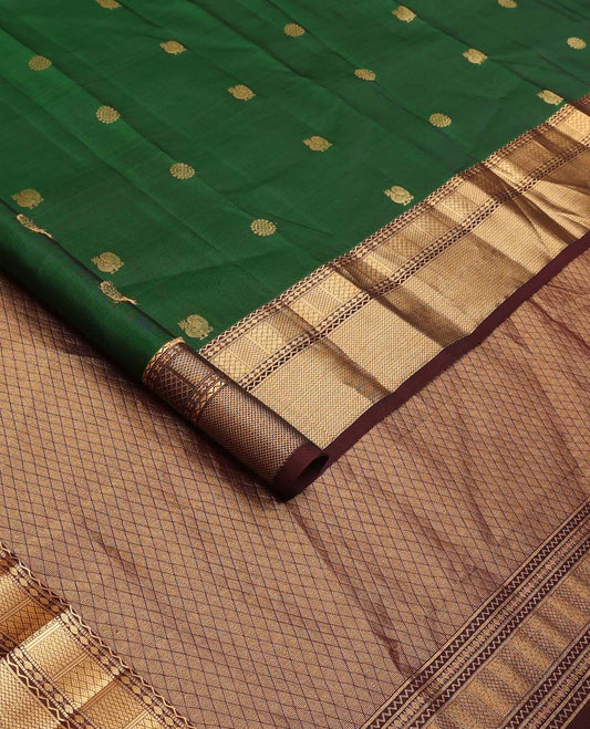 Green annam chakram buttas Vasundhara silk mix saree, contrast border of neli, muthu, rudraksham, paiyaadi kann, and mayil kann designs, and jaal pallu