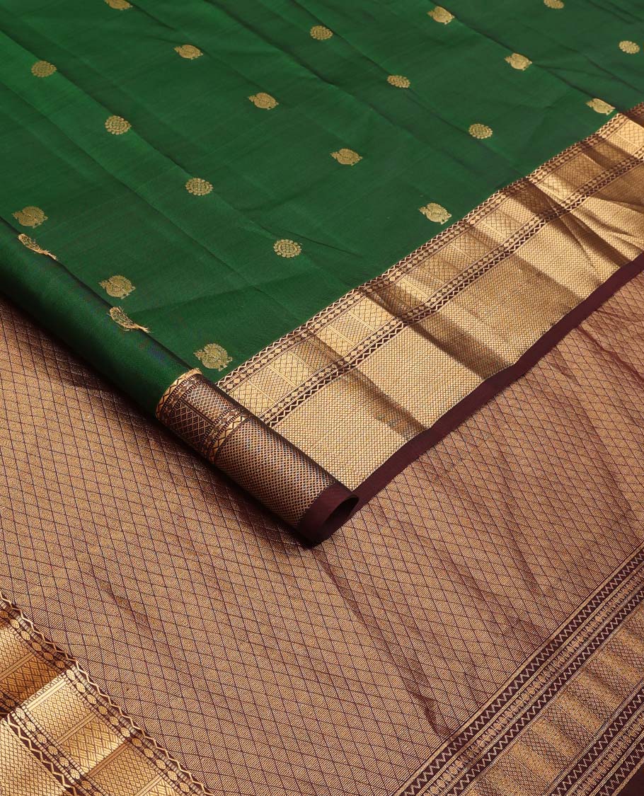 Green annam chakram buttas Vasundhara silk mix saree, contrast border of neli, muthu, rudraksham, paiyaadi kann, and mayil kann designs, and jaal pallu