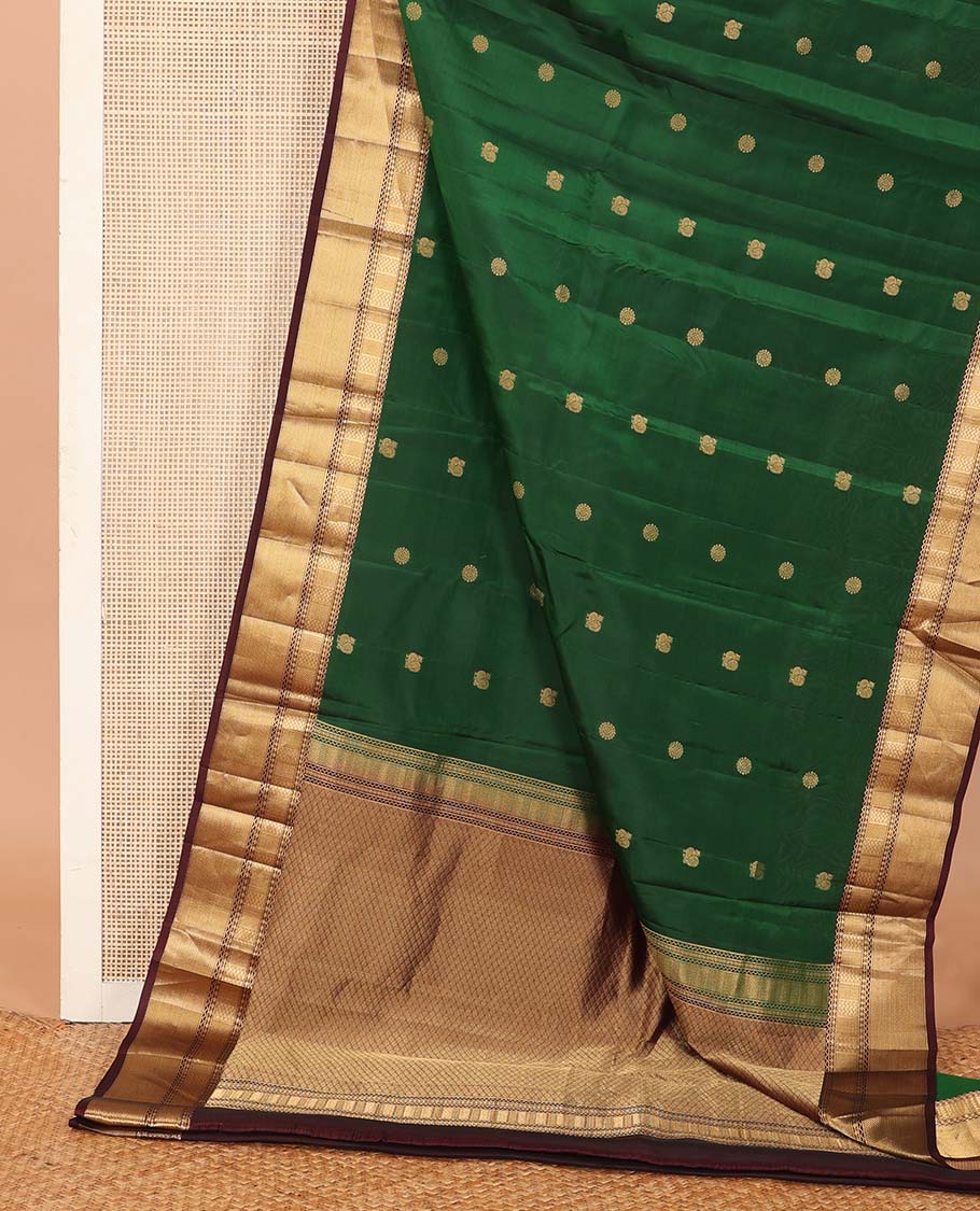 Green annam chakram buttas Vasundhara silk mix saree, contrast border of neli, muthu, rudraksham, paiyaadi kann, and mayil kann designs, and jaal pallu