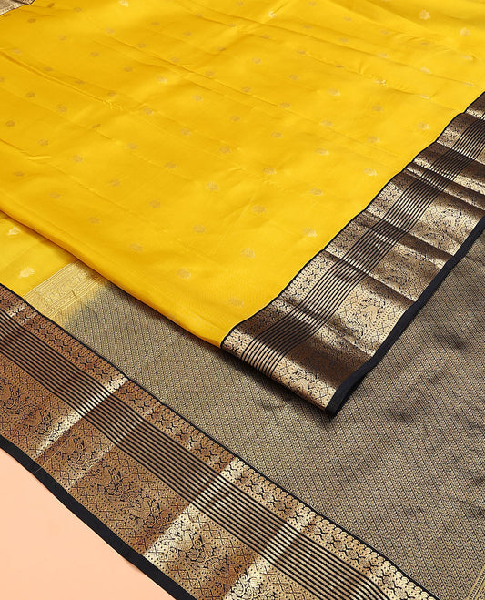 Yellow Vasundhara Lite Silk Mix Saree, Sparsely Woven with Zari Buttas on Its Body, Complemented by a Contrast Border of Manga, Muthu, Kamalam, Banaras, Diamond, and Mayil Designs, Pallu of Leaf Vine Designs, and Paired with a Contrast Blouse
