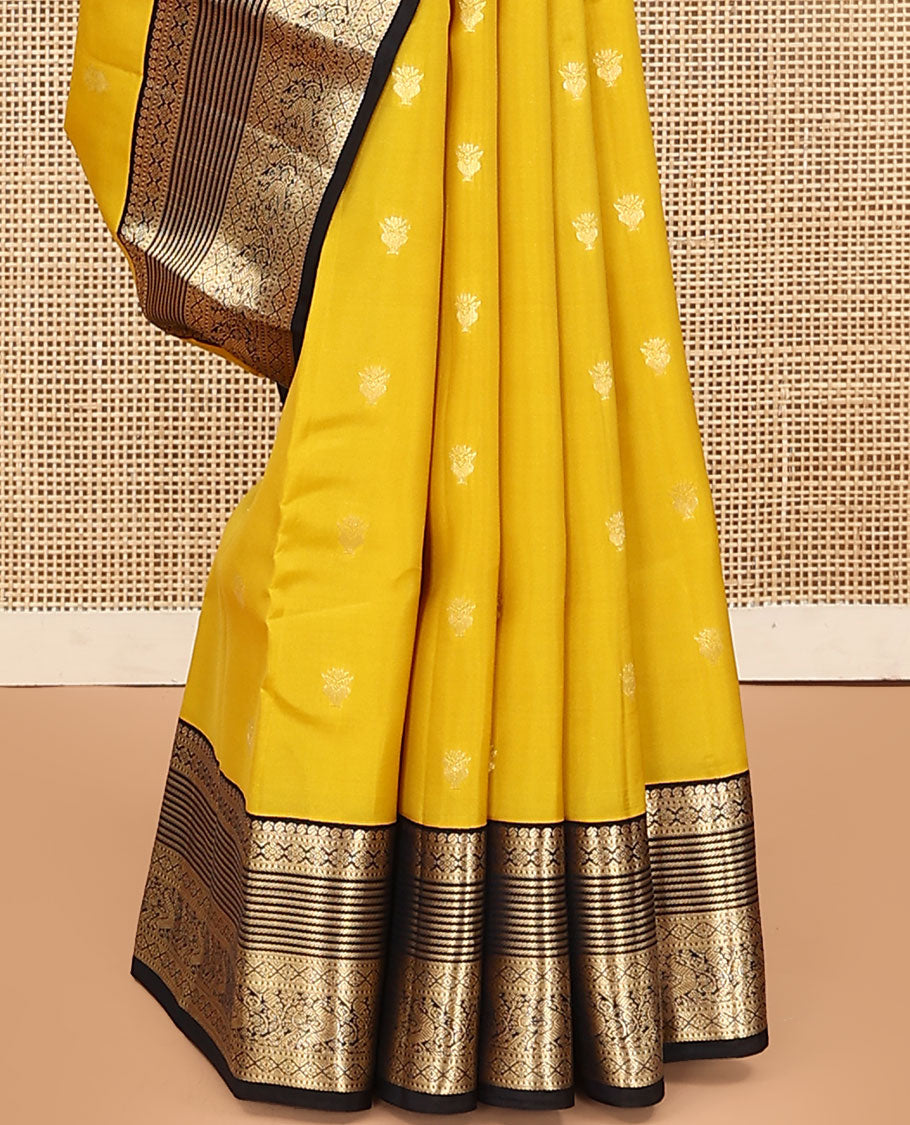 Yellow Vasundhara Lite Silk Mix Saree, Sparsely Woven with Zari Buttas on Its Body, Complemented by a Contrast Border of Manga, Muthu, Kamalam, Banaras, Diamond, and Mayil Designs, Pallu of Leaf Vine Designs, and Paired with a Contrast Blouse