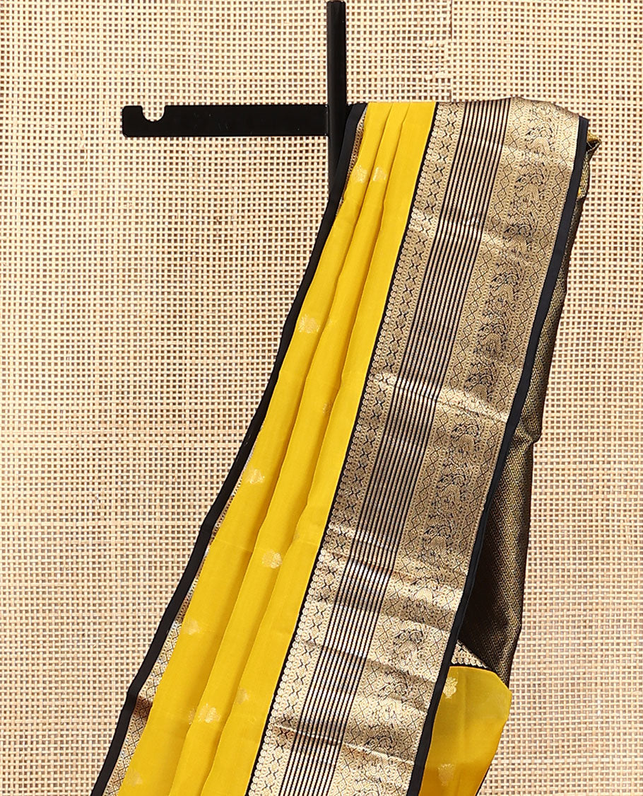 Yellow Vasundhara Lite Silk Mix Saree, Sparsely Woven with Zari Buttas on Its Body, Complemented by a Contrast Border of Manga, Muthu, Kamalam, Banaras, Diamond, and Mayil Designs, Pallu of Leaf Vine Designs, and Paired with a Contrast Blouse