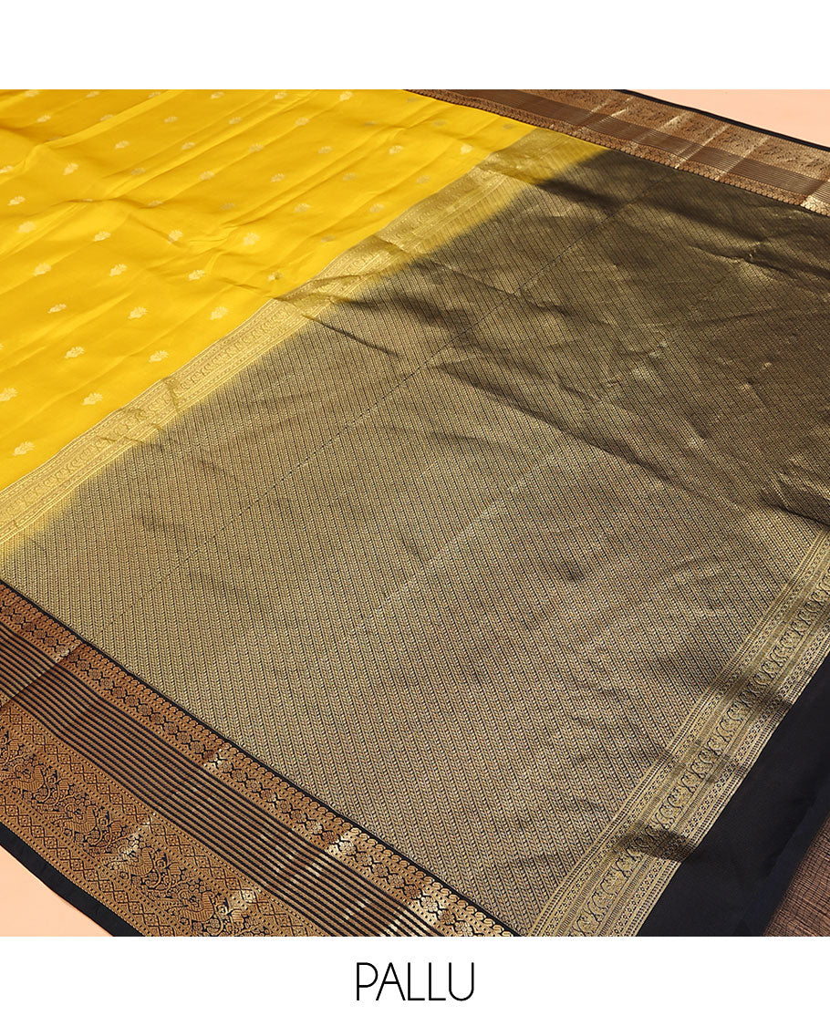 Yellow Vasundhara Lite Silk Mix Saree, Sparsely Woven with Zari Buttas on Its Body, Complemented by a Contrast Border of Manga, Muthu, Kamalam, Banaras, Diamond, and Mayil Designs, Pallu of Leaf Vine Designs, and Paired with a Contrast Blouse