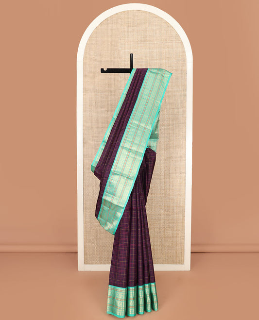 Purple Vasundhara Silk Saree Subtly Sparkled with Checks, Highlighted by a Contrast Border of Rekku, Chakram, and Jada Nagam Designs, Pallu Diagonally Woven in Zari, and Comes with a Contrast Blouse