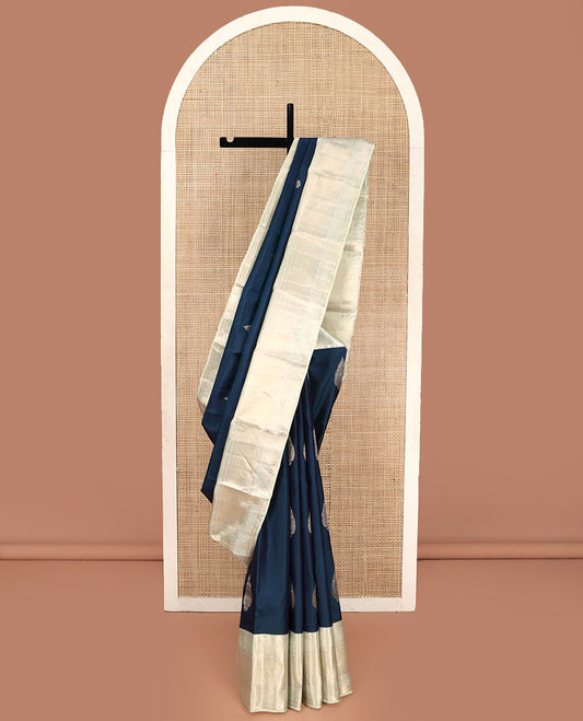 Blue Vasundhara Lite Silk Mix Saree, Elegantly Highlighted with Zari Buttas on Its Body, Complemented by a Contrast Zari Border of Banaras, Paisa, and Mayil Designs, Intricately Designed Pallu, and Paired with a Contrast Blouse