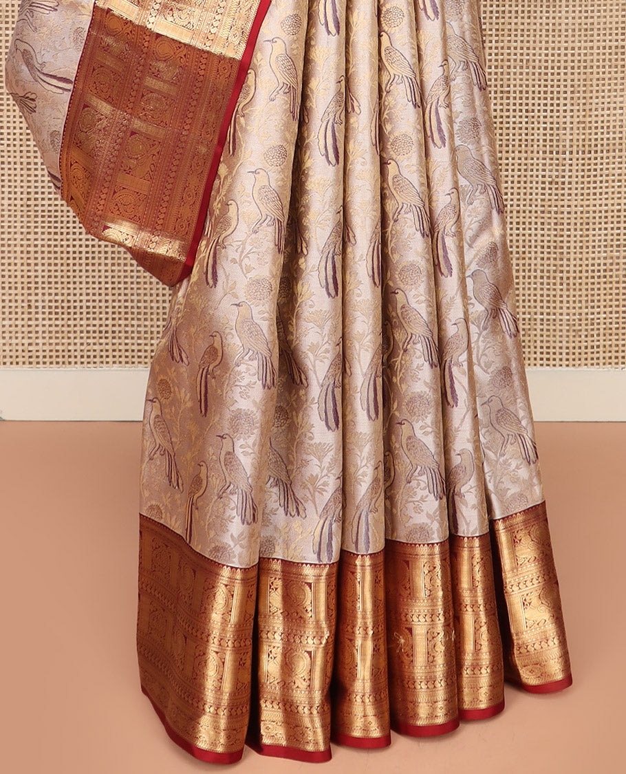 Cream Kanchipuram Silk Saree Artfully Woven with Bird Jacquard Design, Complemented by Contrast Border of Rekku, Mayil, Arumbu Manga, and Chakram Designs, Elegantly Highlighted Pallu of Geometric Patterns, and Paired with a Contrast Blouse