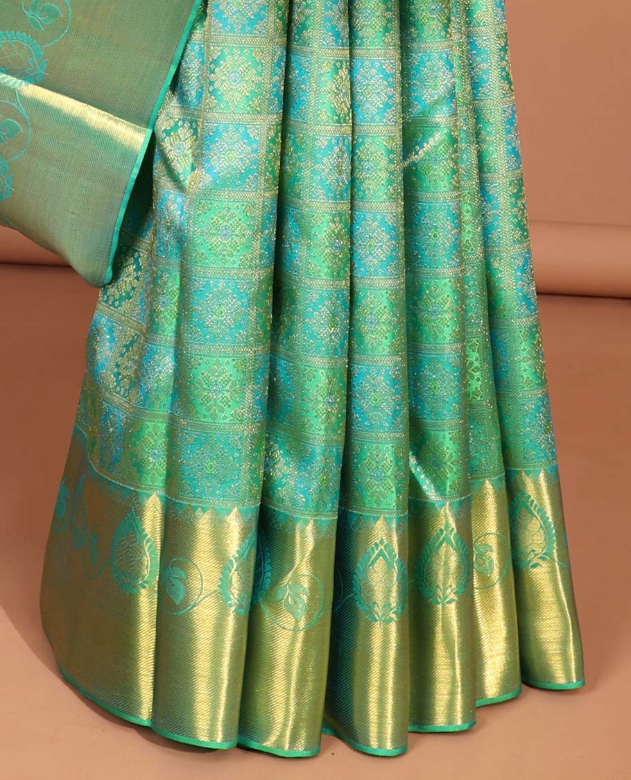Green floral enclosed checked kancheepuram silk saree with self zari design border & floral zari design pallu