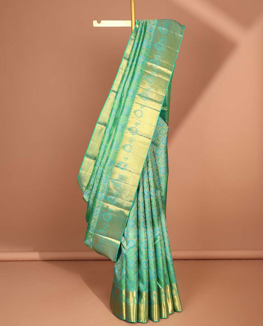 Green floral enclosed checked kancheepuram silk saree with self zari design border & floral zari design pallu