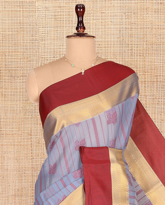 Grey Semi-Silk Cotton Saree, Sparsely Threaded with Buttas and Stripes All Over Its Body, Complemented by a Contrast Border of Traditional Zari Designs, Pallu of Jaal Designs, and Paired with a Matching Blouse