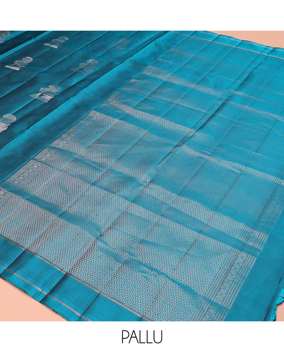 Blue singam buttas soft silk saree, zari striped border, and pallu of vanki designs