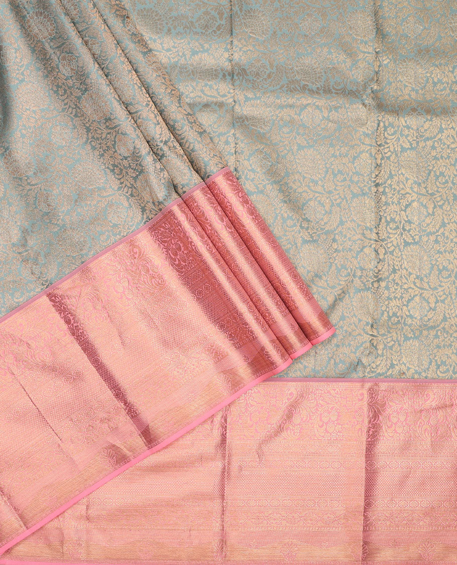 Grey pure-silk half-saree, floral jacquard skirt, contrast blouse, and border of muthu, floral, diamond, kamalam, mayil kann, and kodi visiry designs, and intricate dhavani