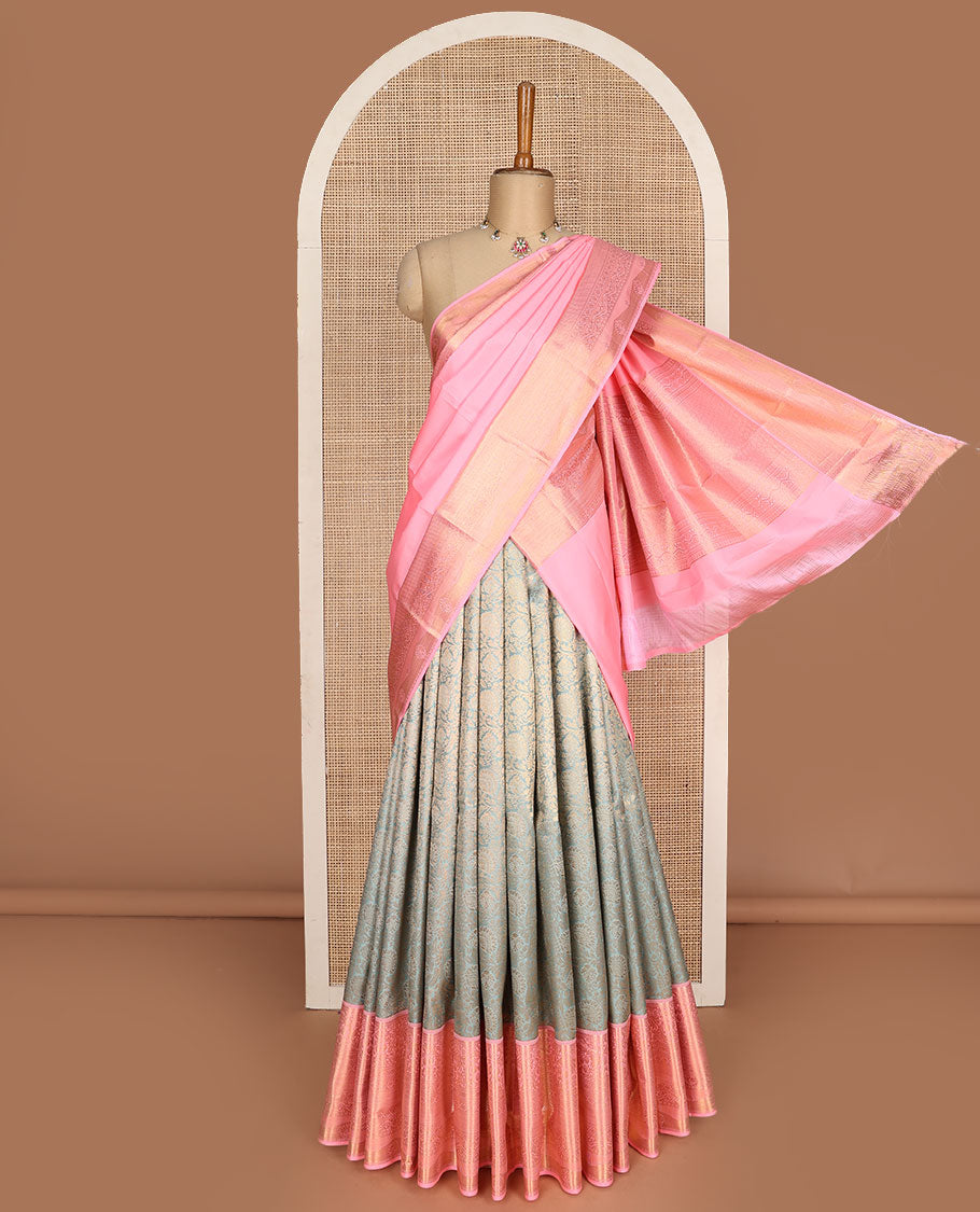 Grey pure-silk half-saree, floral jacquard skirt, contrast blouse, and border of muthu, floral, diamond, kamalam, mayil kann, and kodi visiry designs, and intricate dhavani