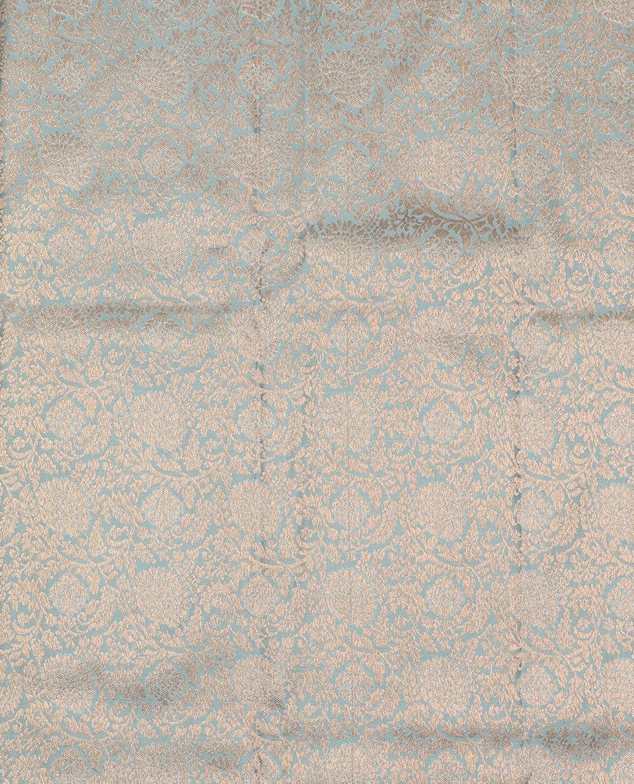 Grey pure-silk half-saree, floral jacquard skirt, contrast blouse, and border of muthu, floral, diamond, kamalam, mayil kann, and kodi visiry designs, and intricate dhavani