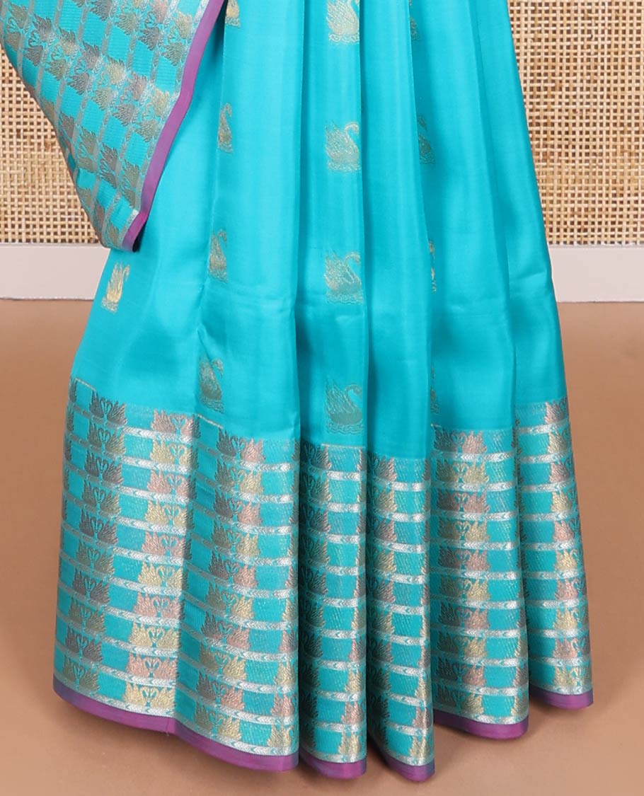 light blue swan buttas vasundhara elite silk saree with self swan design border & floral design pallu