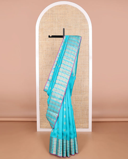light blue swan buttas vasundhara elite silk saree with self swan design border & floral design pallu