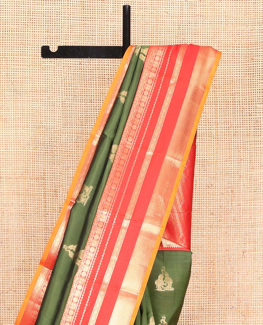 Green Vasundhara Lite Silk Mix Saree, Highlighted by Yaanai Buttas, Complemented by a Contrast Varisai  Pettu Border of Rekku, Muthu, Jada Nagam, Mayil, Neli, Rudraksham, and Mayil Kann Design, Intricately Designed Pallu, and Paired with a Contrast Blouse