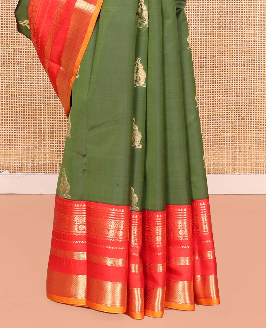 Green Vasundhara Lite Silk Mix Saree, Highlighted by Yaanai Buttas, Complemented by a Contrast Varisai  Pettu Border of Rekku, Muthu, Jada Nagam, Mayil, Neli, Rudraksham, and Mayil Kann Design, Intricately Designed Pallu, and Paired with a Contrast Blouse