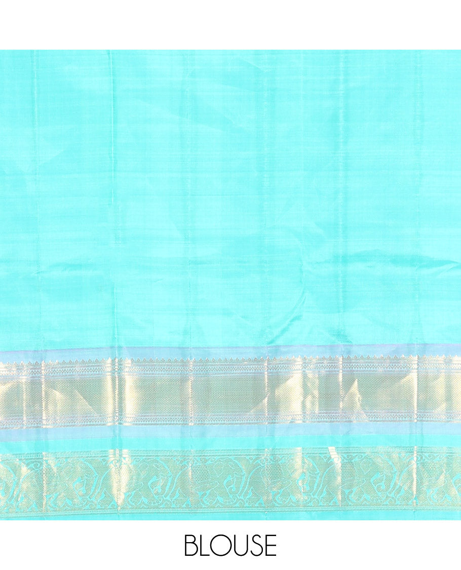 Orange Vasundhara Silk Saree Embellished with Yaanai and Poun Buttas All Over Its Body, Complemented by Zari Border of Neli, Mayil Kann, and Yaanai Designs, a Grand Pallu of Jaal Designs, and Paired with a Contrast Blouse