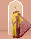 Yellow Dola Silk Saree, Artfully Detailed with Floral Jaal Design on Its Body, Complemented by Contrast Paisley Design Border, Intricately Designed Pallu, and Paired with a Contrast Blouse