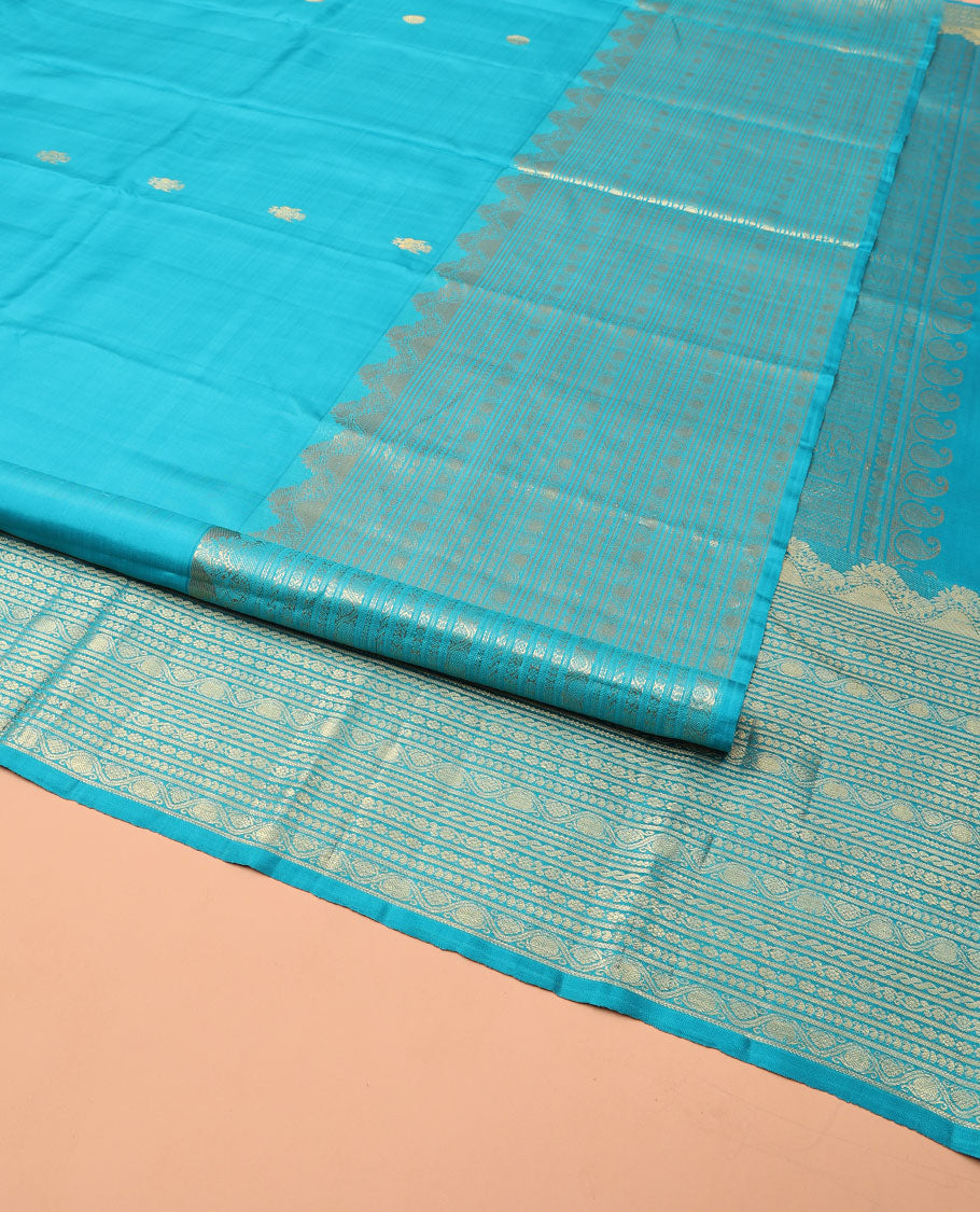 Blue Kanchipuram Silk Saree, Decorated with Iruthalai Pakshi Buttas All Over Its Body, Highlighted by a Zari Border of Puli Nagam, Manga, Kamalam, and Kodi Visiry Designs, Pallu of Human Figurines, and Paired with a Matching Blouse