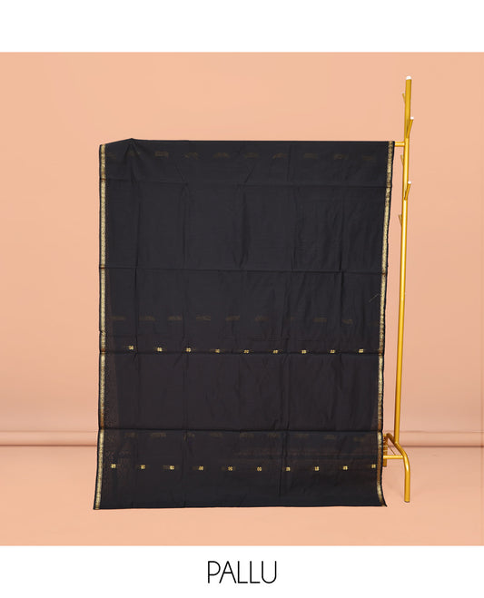 Black Maheshwari Cotton Saree, Embellished with Buttas All Over Its Body, Subtle Zari Piping Border, Complemented by a Contrast Pallu Steeped with Buttas, and Paired with a Contrast Blouse