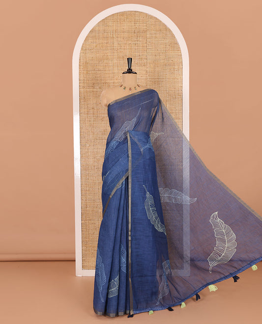 Indigo big feather motifs printed linen cotton saree, piping border, feather motifs printed pallu, and a contrast feather motifs printed blouse