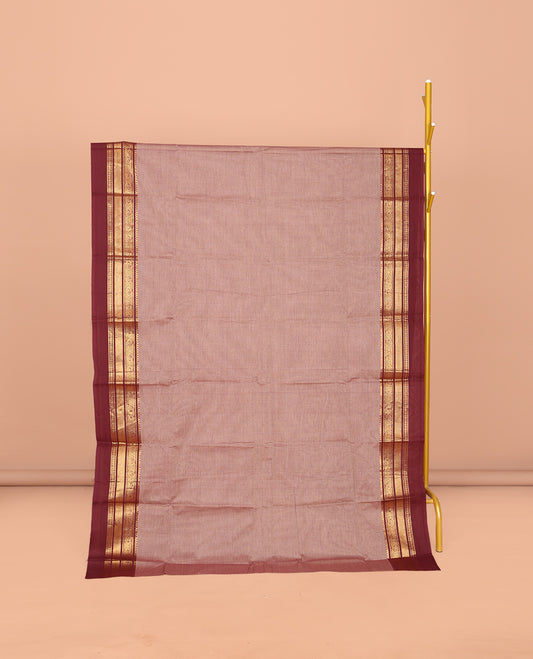 Pale Brown Plain Chettinad Cotton Saree, Complemented by Contrast Traditional Zari Design Kal Eragina Border of Paisleys, Striped Pallu, and Paired with Matching Blouse
